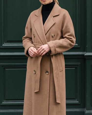 The Calvera double-breasted wool coat in khaki — front view on model