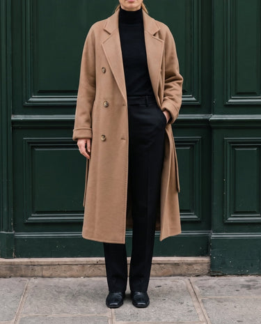 The Calvera double-breasted wool coat in khaki — front view with hand in pocket on model