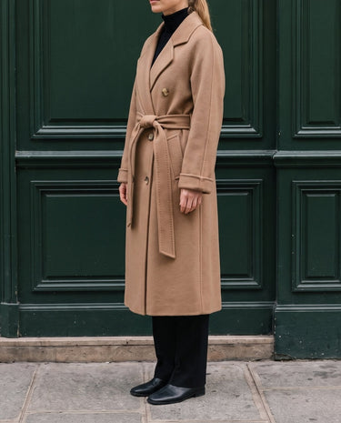 The Calvera double-breasted wool coat in khaki — side view on model