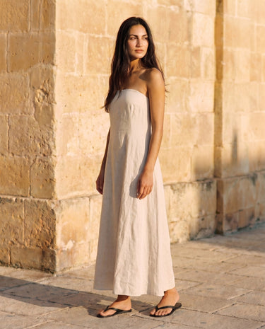Camille Strapless Cotton Maxi Dress in khaki — strapless maxi dress, three-quarter view on model