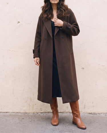 The Chocolate Maxi Coat in chocolate brown — longline coat worn open, front view on model