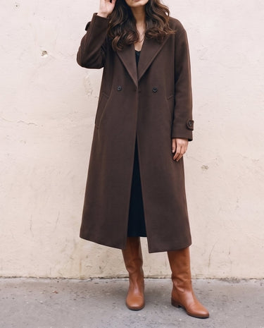 The Chocolate Maxi Coat in chocolate brown — longline coat, front view on model