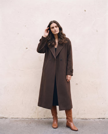 The Chocolate Maxi Coat in chocolate brown — longline coat, front view on model