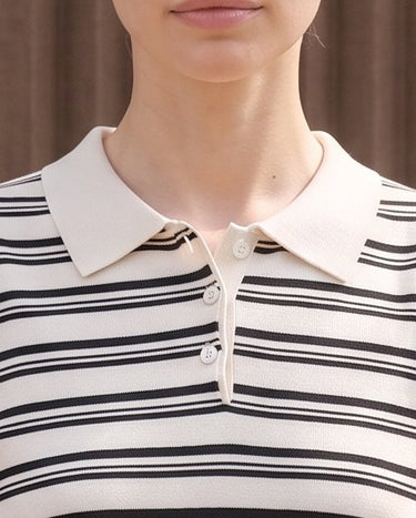 Cosetta Polo in white — close-up of the cream collar and three-button placket