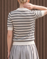 Cosetta Polo in white — back view on model showing the striped knit