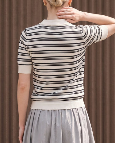 Cosetta Polo in white — back view on model showing the striped knit