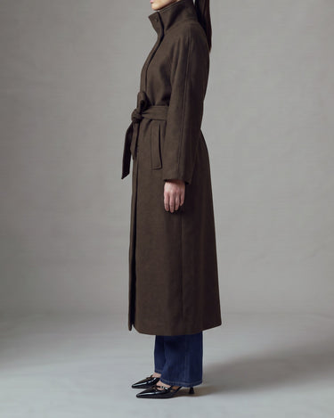Henrietta Coat in brown, side view of the tall funnel collar and long straight silhouette