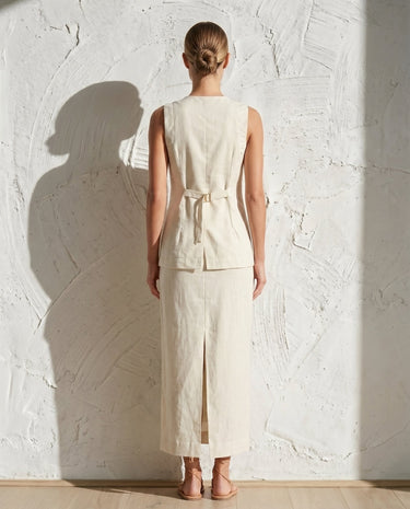 Cream vest and maxi skirt set on model, back view – Moriel Heritage