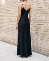 Back view of the black Eclipse Satin Dress showing the low V back and slim shoulder straps