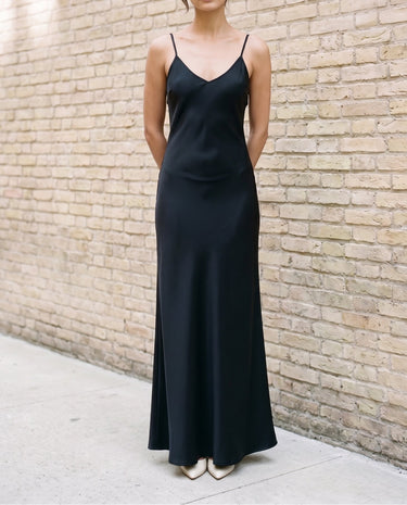 Straight-on front view of the black Eclipse Satin Dress showing the full length of the slip silhouette