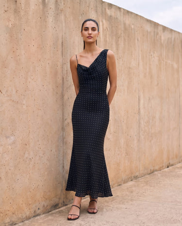 The Elowen Polka Dot Dress in black polka dot — slip maxi dress, front view on model