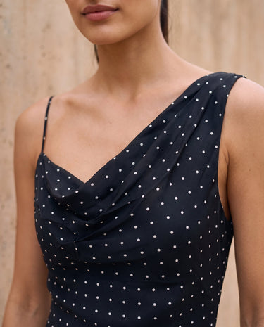 The Elowen Polka Dot Dress in black polka dot — close-up of the cowl neckline and polka-dot fabric