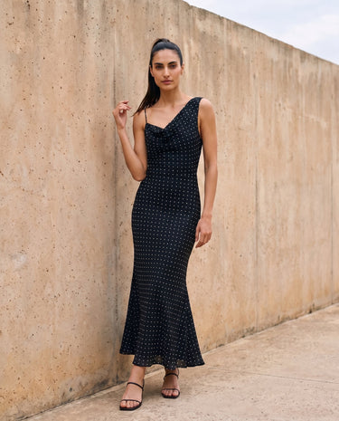 The Elowen Polka Dot Dress in black polka dot — slip maxi dress, front view on model