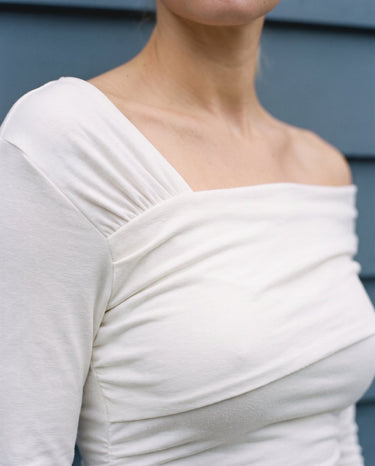 Close-up of the top's folded asymmetric shoulder drape – Moriel Heritage