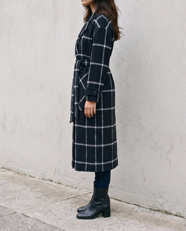 The Emilia Grid Longline Coat in black windowpane check — longline coat, side view on model