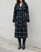 The Emilia Grid Longline Coat in black windowpane check — longline coat, front view on model