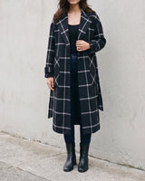 The Emilia Grid Longline Coat in black windowpane check — longline coat worn open, front view on model