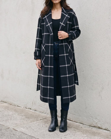The Emilia Grid Longline Coat in black windowpane check — longline coat worn open, front view on model