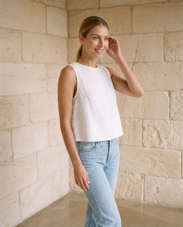 Everyday Ease Swing Top in white — sleeveless swing top, side view on model