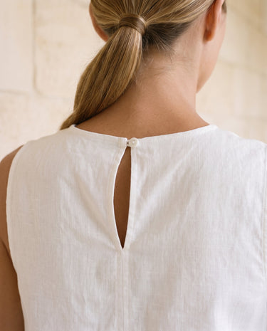Everyday Ease Swing Top in white — close-up of keyhole back button closure