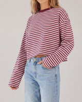 Everyday Stripe in burgundy and pink — three-quarter front view on model showing the wide sleeves