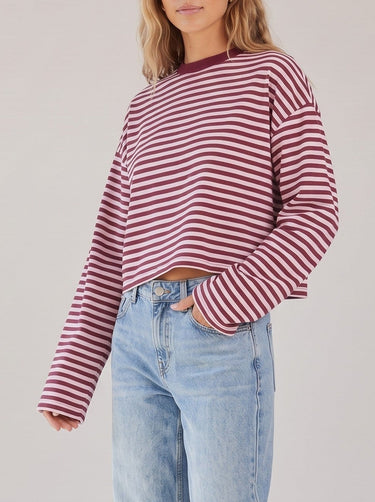 Everyday Stripe in burgundy and pink — three-quarter front view on model showing the wide sleeves