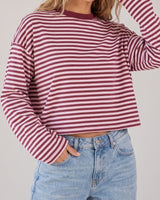 Everyday Stripe in burgundy and pink — waist-up three-quarter view on model, hand in pocket