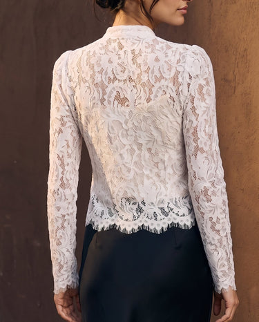 Florence Blouse in white — back view on model showing the sheer lace and scalloped hem