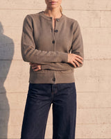 The Frankie Knit Cardi in khaki — soft knit button-front cardigan, front view on model with indigo wide-leg jeans