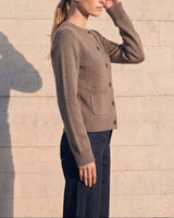 The Frankie Knit Cardi in khaki — side profile on model showing the fitted waist