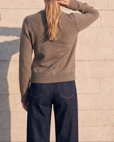The Frankie Knit Cardi in khaki — back view on model showing the seam-free back panel