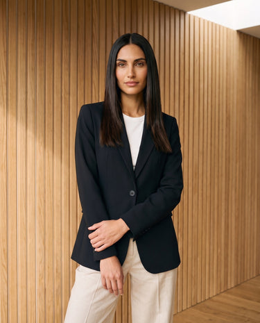 Graciela Cinch Waist Blazer in black — single-button blazer, side view on model