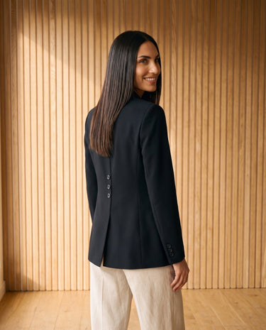 Graciela Cinch Waist Blazer in black — cinch-waist blazer showing back, three-quarter back view on model