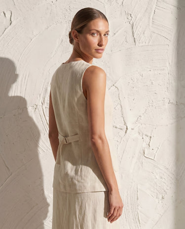 Cream vest and skirt set on model, over-shoulder back view – Moriel Heritage