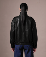 Hallie Funnel Jacket in black — back view showing the shoulder seams and hem