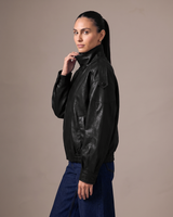 Hallie Funnel Jacket in black — close-up of the funnel collar and zip pull