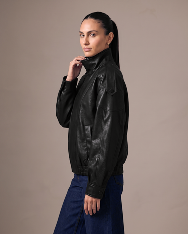 Hallie Funnel Jacket in black — close-up of the funnel collar and zip pull