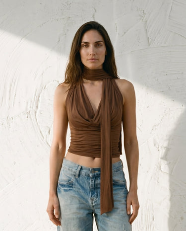 Brown draped halter top on model, styled with jeans – Moriel Heritage