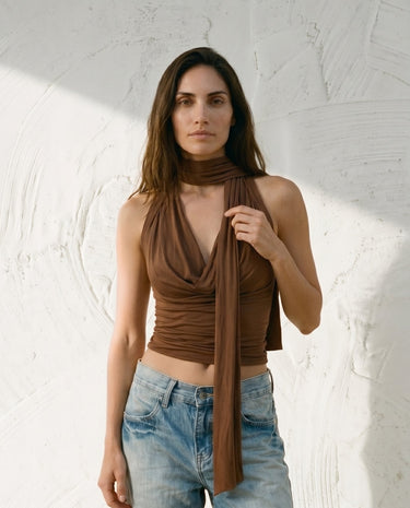 Brown draped halter top on model, relaxed view – Moriel Heritage