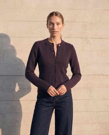 The Frankie Knit Cardi in aubergine — full front view on model showing the hip-length hem