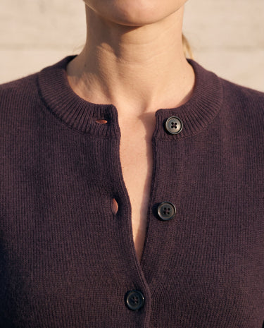 The Frankie Knit Cardi in aubergine — close-up of the band collar and off-centre button placket