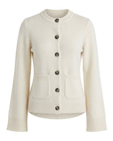 The Frankie Knit Cardi in cream — soft knit button-front cardigan with dark horn buttons, flat-lay