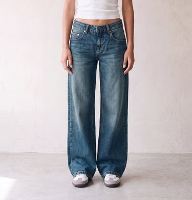 Harlow Low Rise Jeans in washed blue — low-rise baggy jeans styled with a white tank, front view on model