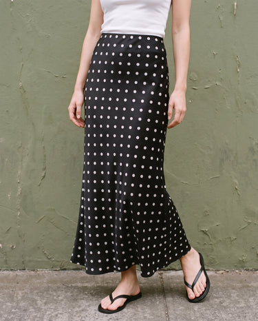 Hattie Polka Dot Skirt in black — front three-quarter view on model