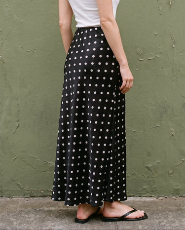 Hattie Polka Dot Skirt in black — back three-quarter view on model