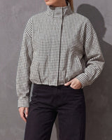 Henley Jacket in black and white gingham with stand collar, worn with black wide-leg jeans