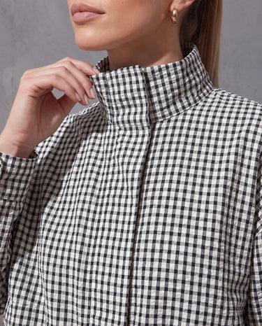 Close-up of the Henley Jacket stand collar and textured seersucker gingham