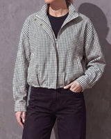 Henley Jacket half-zipped with the collar open, black and white gingham, worn over a black top
