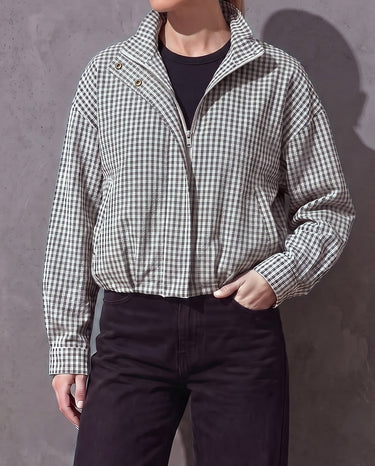 Henley Jacket half-zipped with the collar open, black and white gingham, worn over a black top