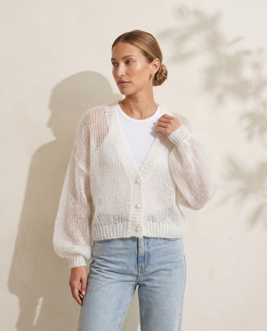 Marisol Knit Cardigan in White worn over a white ribbed tank with light-wash jeans, front view